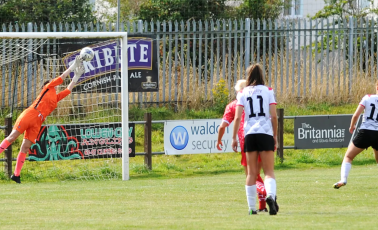 Laura O'Sullivan stretches to keep a penalty out